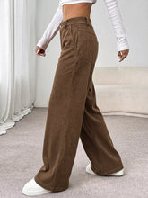 Brown corduroy wide leg casual pants with high waist and front pockets for a comfortable stylish look