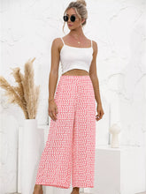 Pink polka dot wide leg pants featuring a white dot wide leg pattern ideal for casual wear