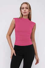 Magenta ribbed sleeveless crop top with high neckline, machine wash cold