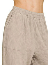 Beige textured cotton double gauze elastic band pants with elastic waistband and single patch pocket by zenana
