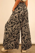 Very j full size printed wide leg pants in black and cream featuring an intricate swirling leaf pattern