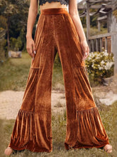 Copper-colored velvet high waist wide leg pants featuring tiered ruffles at the hem for elegant style