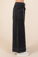 Black mittoshop mineral wash wide-leg twill pants with elastic waistband, drawstring, and front patch pockets