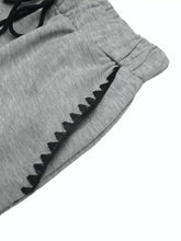 Gray heathered wide-leg drawstring pants with black zigzag trim and machine wash care instructions