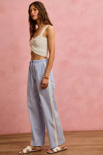 Light blue and white wide check pants with side lace trim and piping featuring a wide leg design