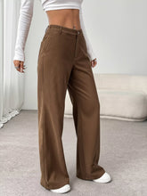 Brown corduroy wide-leg pants with a straight cut and front pockets ideal for wide leg casual wear