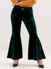 Plus size emerald green velvet flared pants with a silver-toned belt buckle featuring velvet flare details