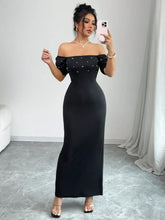 Black satin off-shoulder gown with pearl embellishments and puff sleeves
