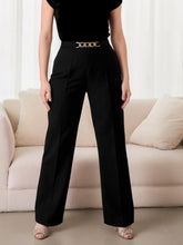 Plus size black high-waisted wide-leg pants with chain waist and gold-toned buckle, machine wash care instructions