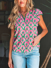 Pink and green heart patterned short sleeve blouse with ruffled edges and striped trim polo collar design