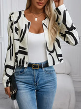 White and black abstract print blazer with puffed sleeves