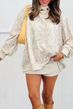 Cream-colored abstract print long sleeve oversized sweatshirt with gray marbled pattern and ribbed cuffs machine wash cold