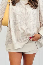 Abstract print long sleeve oversized sweatshirt in off-white with a subtle gray marbled pattern suitable for machine wash cold