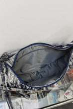 Navy blue and white abstract striped canvas sling bag with zipper and adjustable strap