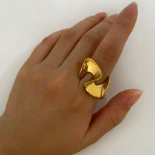 Shiny 18K gold-plated abstract wave ring on hand