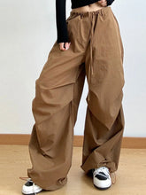 Brown wide leg casual drawstring pants with loose fit, cargo style, side pockets, and perfect fit waist design