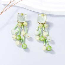 Acrylic bead dangle earrings with pale green stones and beaded tassels
