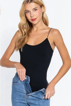 Black ribbed round neck spaghetti strap camisole top made of seamless fabric in active basic style