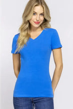 Woman in active basic v-neck short sleeve t-shirt and jeans