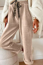 Beige corduroy loose fit pants featuring a leopard drawstring loose fit for comfortable casual wear