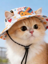 Cute orange and white kitten in adjustable chin strap pet bucket hat