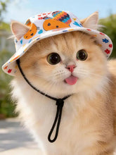 Fluffy orange kitten in adjustable chin strap pet bucket hat