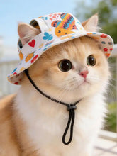 Pet bucket hat with adjustable black chin strap and colorful heart cat patterns