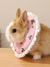 Pink ruffled adjustable pet collar with black paw prints on bunny