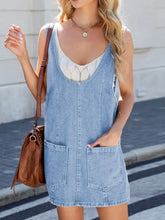 Light blue adjustable strap denim sleeveless overall dress with front pockets and white lace-trimmed inner top