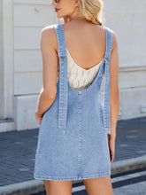 Light-wash denim overall dress with adjustable strap denim design and backless style for casual wear