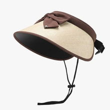 Beige polyester adjustable sun hat with brown bow and chin strap