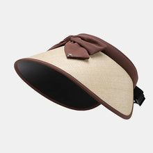 Polyester adjustable sun hat with straw visor, brown fabric bow, and trim