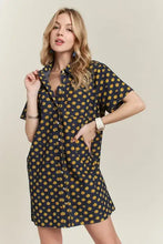 Adora floral button-up mini denim dress in navy blue with yellow floral pattern and short sleeves