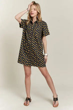 Adora floral button-up mini denim dress in navy blue with yellow daisy pattern on a short-sleeved shirt dress