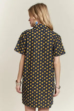 Navy blue adora floral button-up mini denim dress with short sleeves and a yellow flower pattern