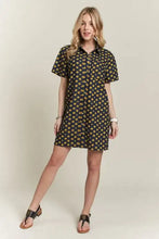 Adora floral button-up mini denim dress in navy blue with short sleeves and a small yellow daisy pattern