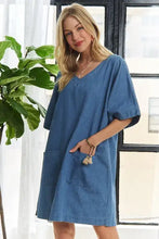 Adora v-neck half sleeve mini denim dress in blue featuring a v-neckline and short sleeves for casual wear