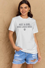 White short sleeve tee with dog paw graphic and distressed denim shorts
