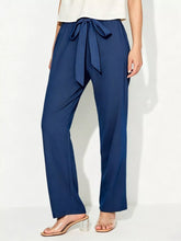Navy blue tied wide leg pants featuring a matching self-tie belt and wide leg silhouette for stylish comfort