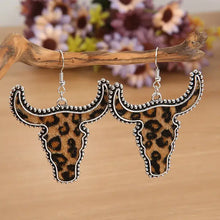 Alloy animal print cow head dangle earrings with leopard skull design
