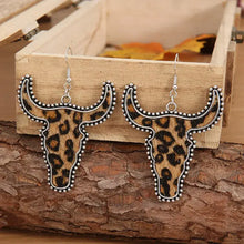 Alloy animal print cow head earrings with bull skull, leopard print, and silver accents