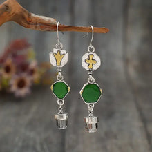 Alloy asymmetric earrings with silver dangles, green glass, and gold accents