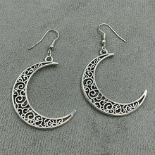 Silver alloy cutout moon earrings with filigree crescent design