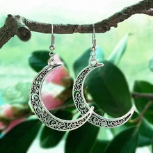 Silver alloy cutout moon earrings with filigree crescent design