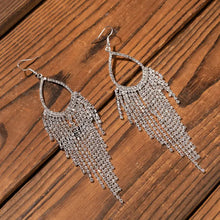 Alloy dangle earrings with silver-toned teardrop rhinestone strands