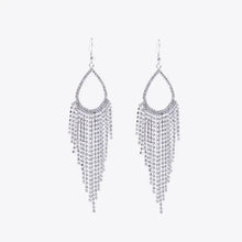Silver-toned alloy dangle earrings with teardrop chandelier rhinestones