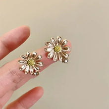 Gold-toned alloy drip oil flower stud earrings with crystal accents