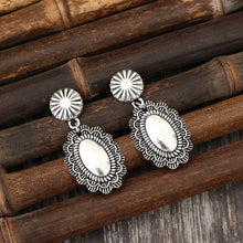 Antique silver-tone alloy flower dangle earrings with oval drop
