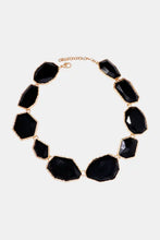 Black zinc alloy frame resin statement necklace with gold accents and multicolored faceted stones