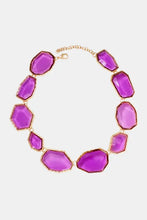 Alloy frame resin necklace with purple stone, gold accents, multicolored faceted stones